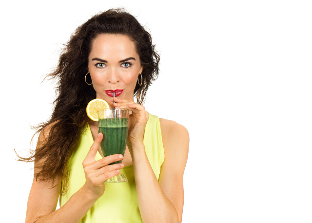 Healthy woman drinking rejuvenate lemonade