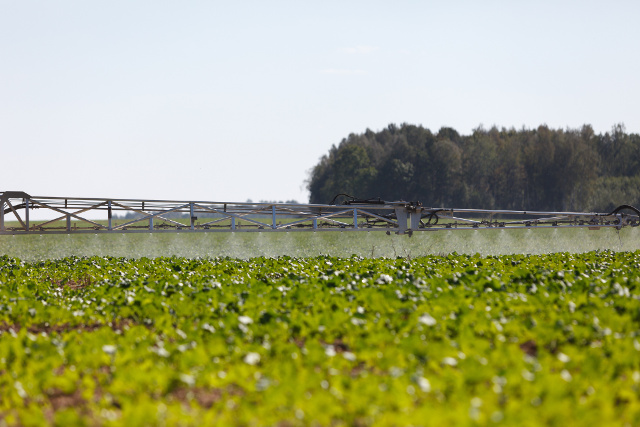 spray pesticides farm equipment conventional gmo