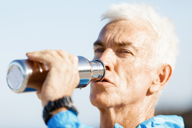 man drinks water infused with molecular hydrogen